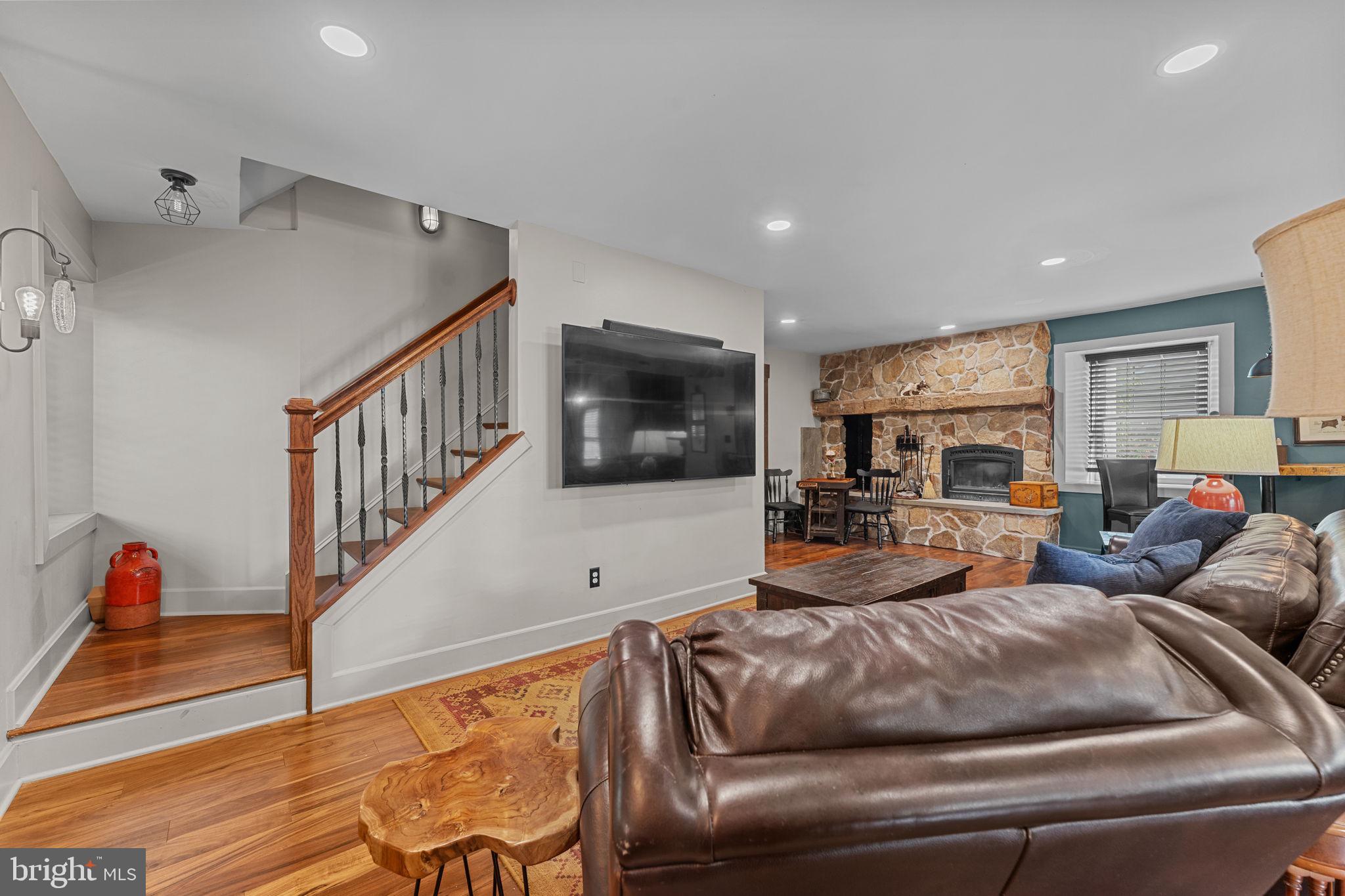 10 Arlington Road Malvern, PA 19355 - Photo 12 of 38 a living room with furniture and a flat screen tv