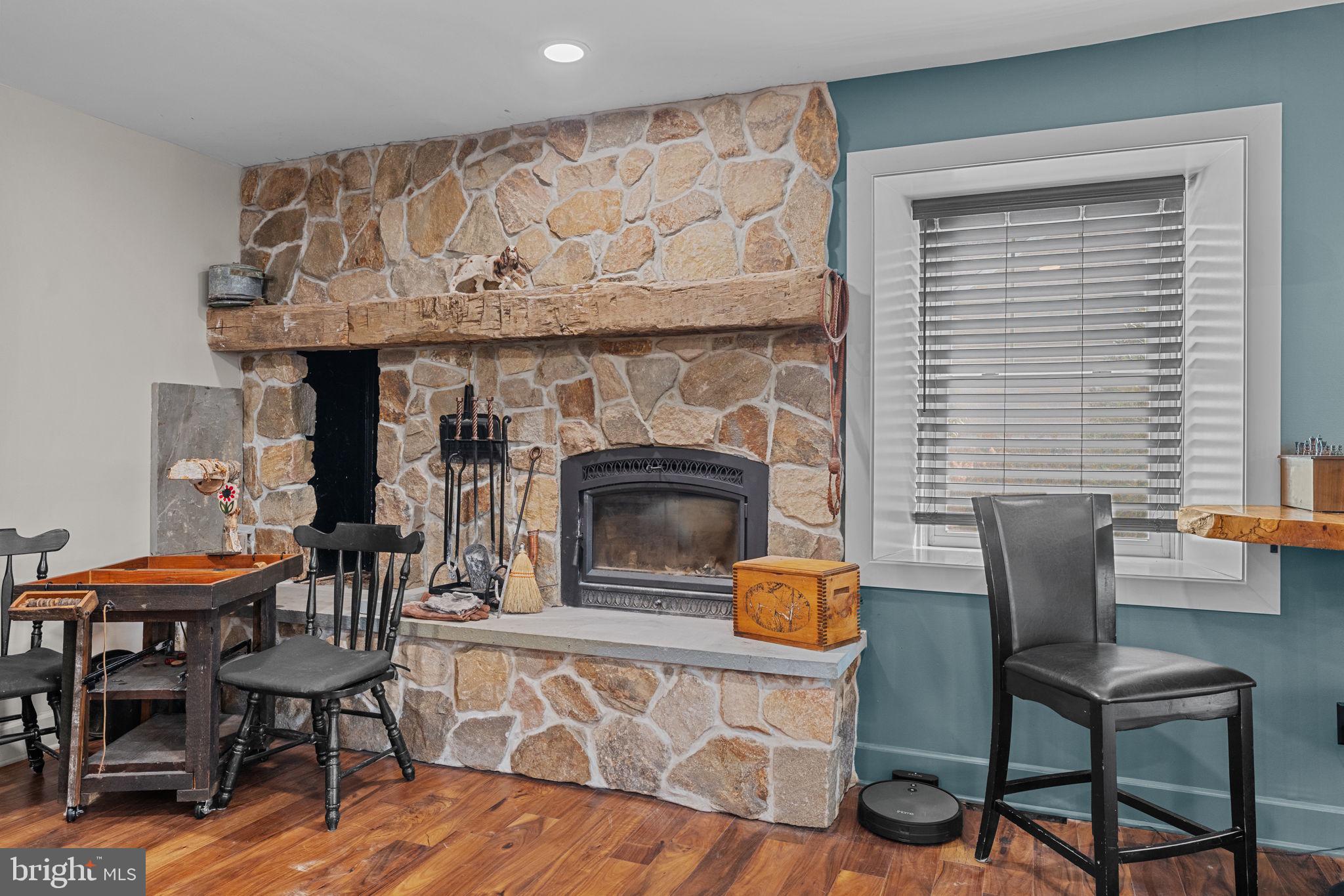 10 Arlington Road Malvern, PA 19355 - Photo 13 of 38 a living room with furniture and a fireplace