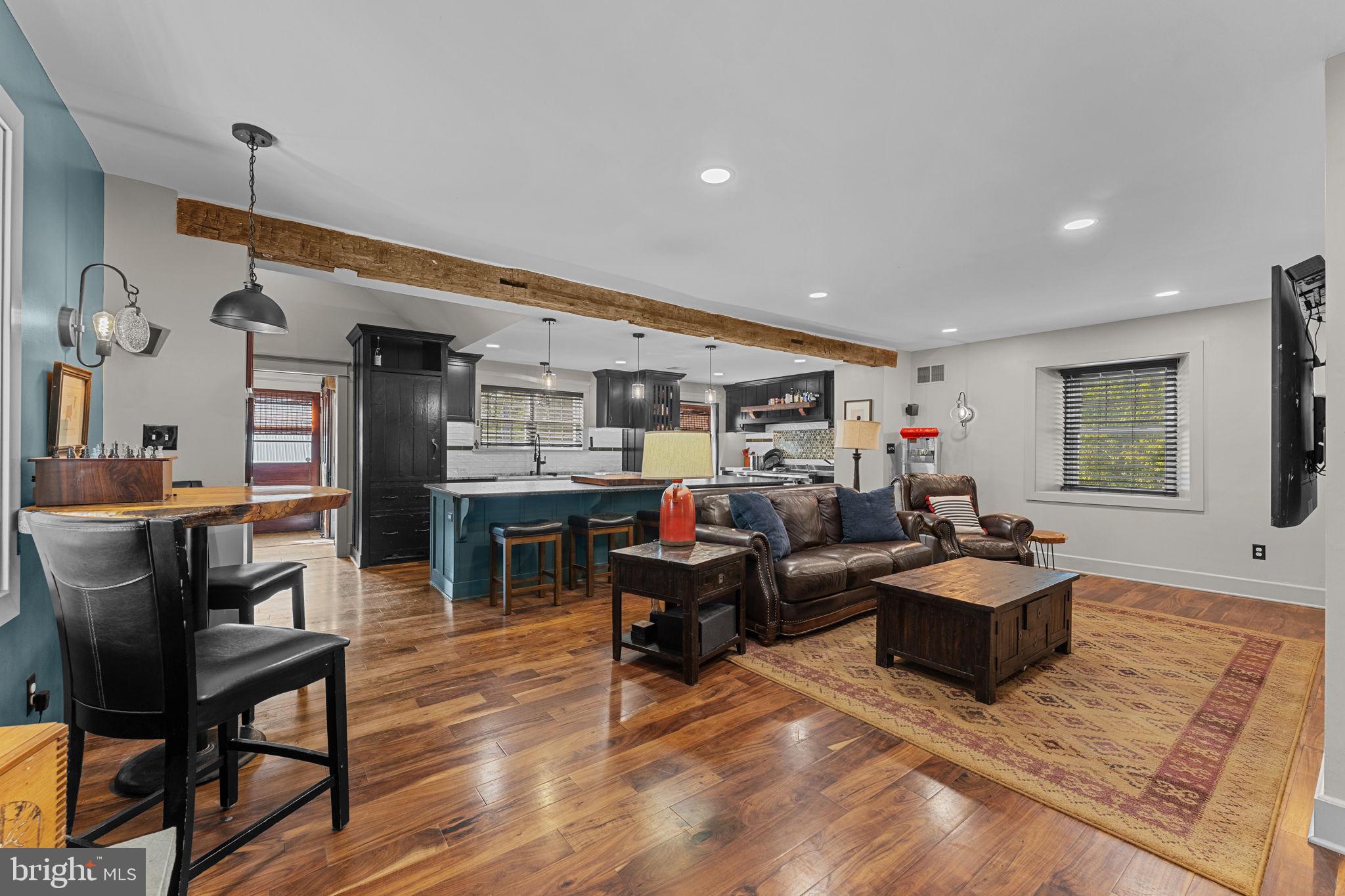 10 Arlington Road Malvern, PA 19355 - Photo 14 of 38 a living room with furniture kitchen view and a wooden floor