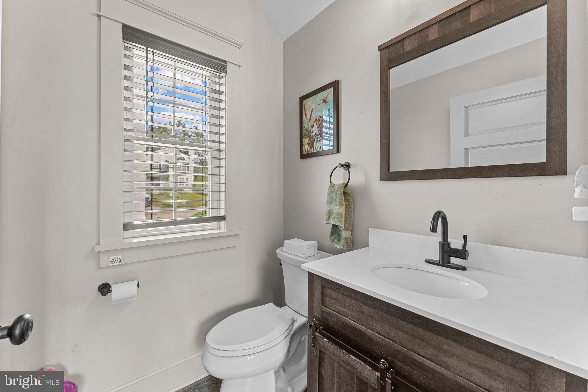10 Arlington Road Malvern, PA 19355 - Photo 20 of 38 a bathroom with a sink a toilet and a mirror