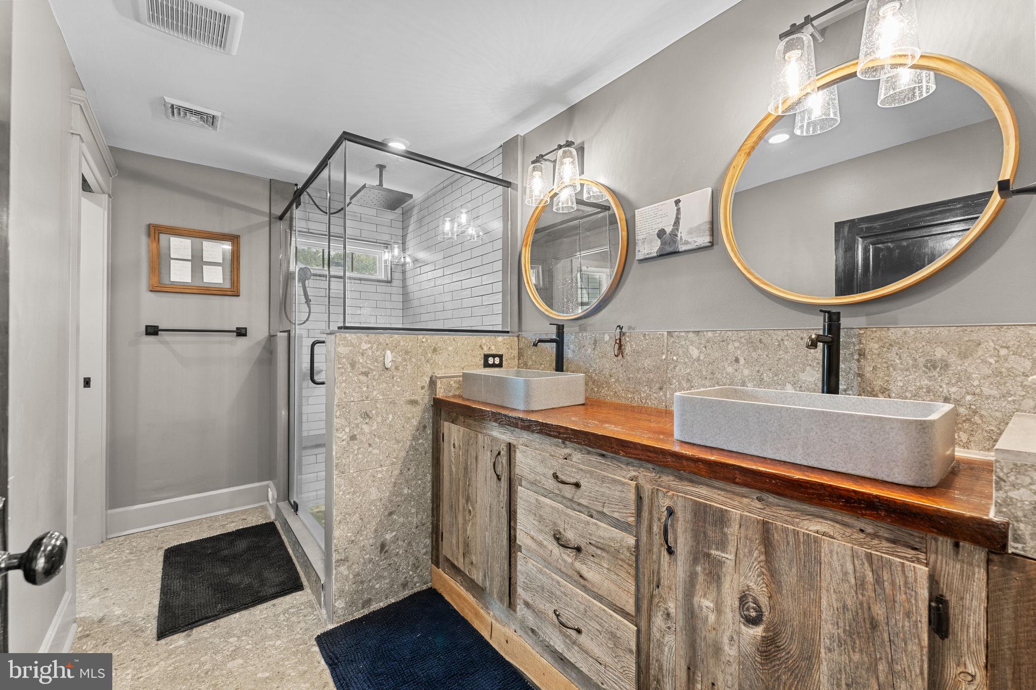 10 Arlington Road Malvern, PA 19355 - Photo 24 of 38 a bathroom with a double vanity sink mirror and a toilet