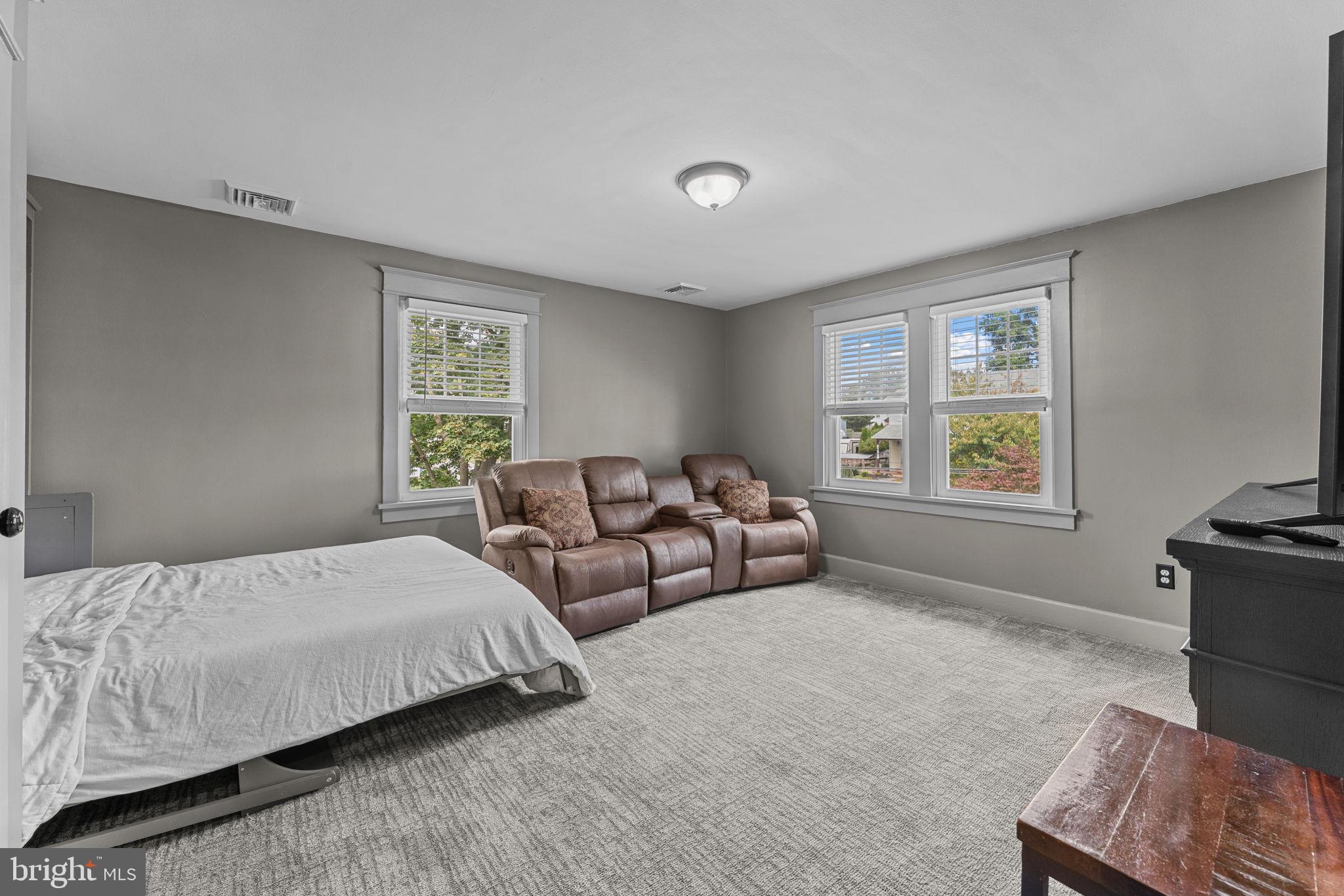 10 Arlington Road Malvern, PA 19355 - Photo 28 of 38 a bedroom with two beds and a window