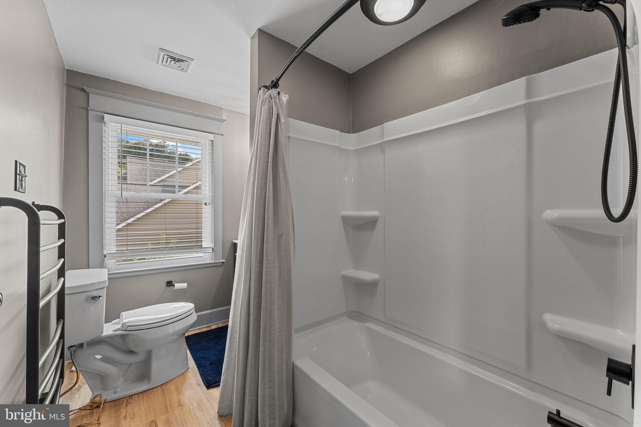 10 Arlington Road Malvern, PA 19355 - Photo 33 of 38 a bathroom with a toilet and a bathtub