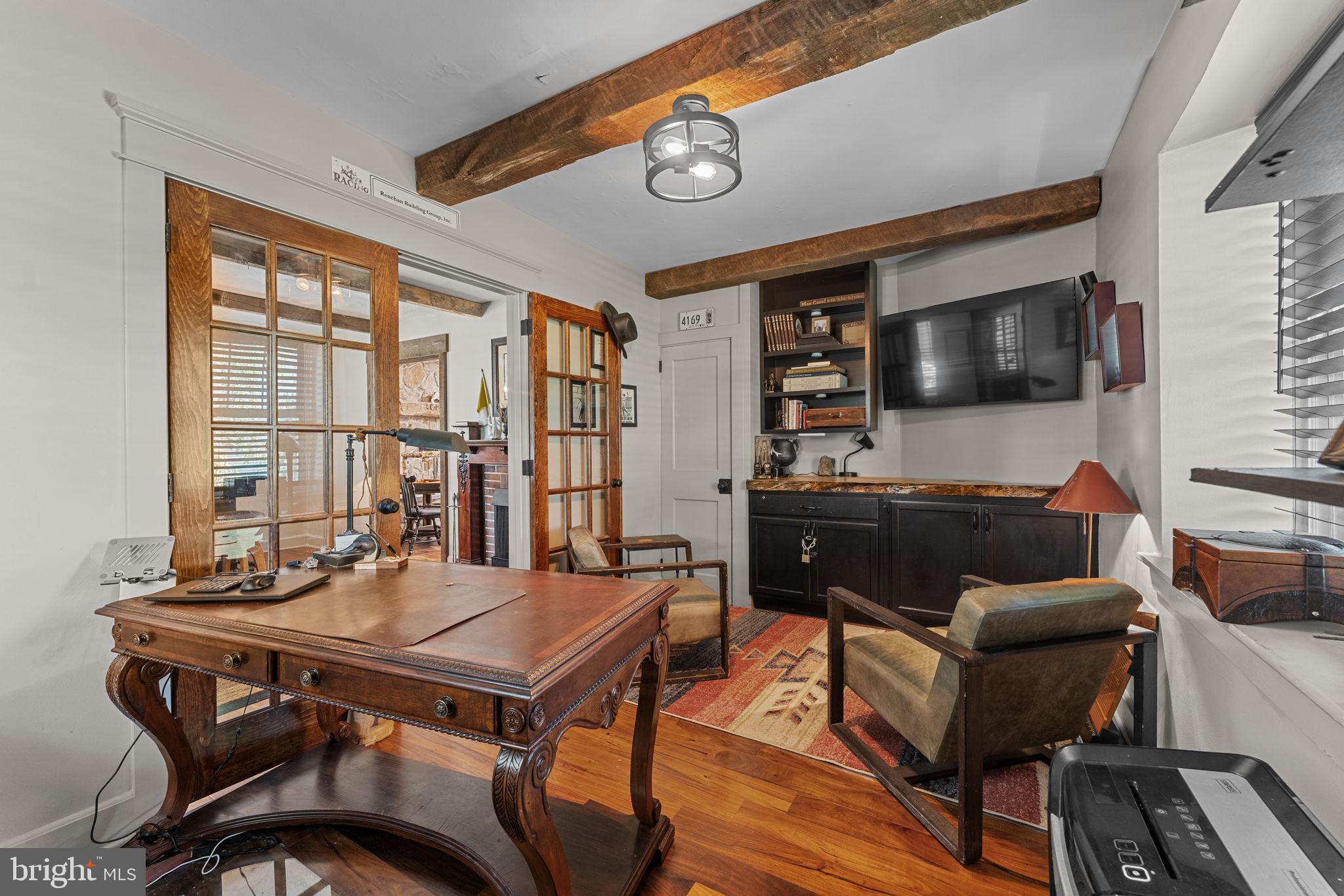 10 Arlington Road Malvern, PA 19355 - Photo 9 of 38 a living room with furniture and a flat screen tv