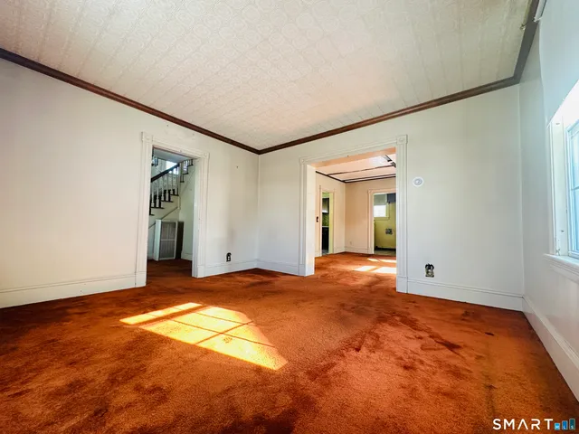 a view of an empty room and window