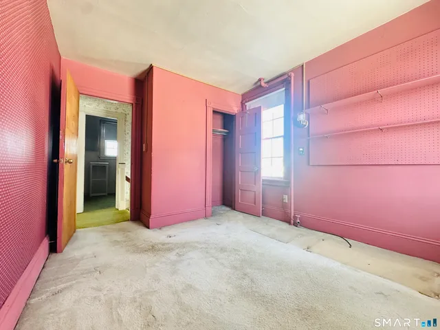 an empty room with fan