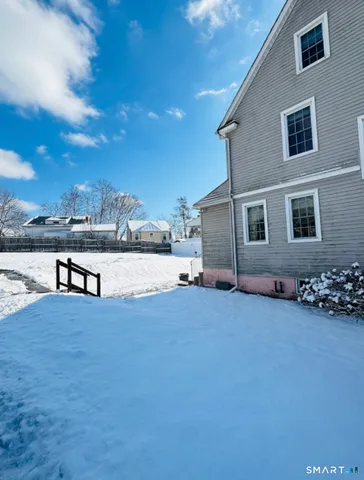 a view of a house with yard and lake view