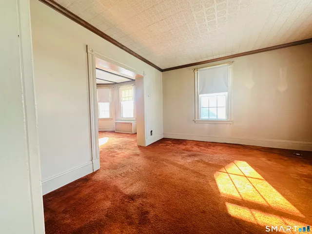 a view of an empty room and window