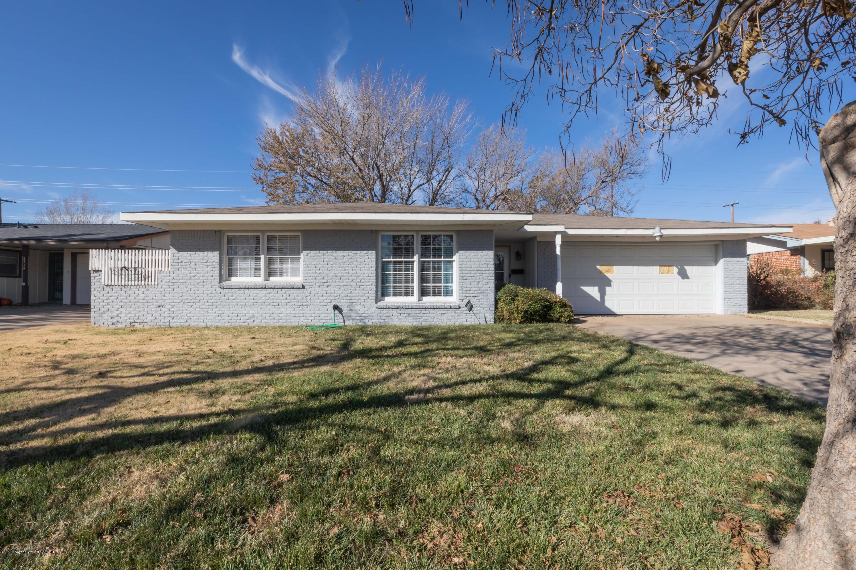 4712 South Bryan Street Amarillo, TX 79110 - Photo 1 of 36 a front view of a house with a yard