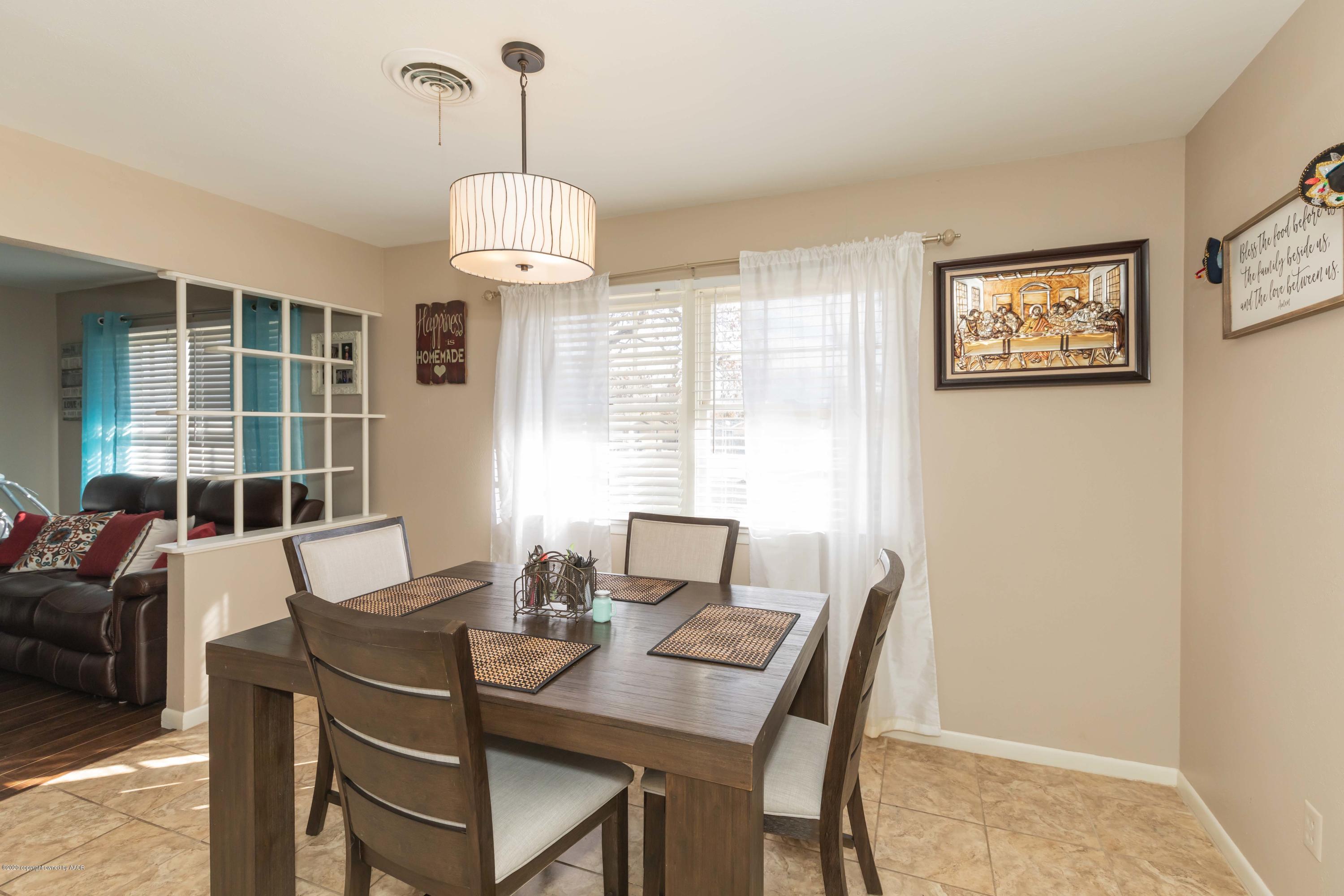 4712 South Bryan Street Amarillo, TX 79110 - Photo 13 of 36 a view of a dining room with furniture window and outside view