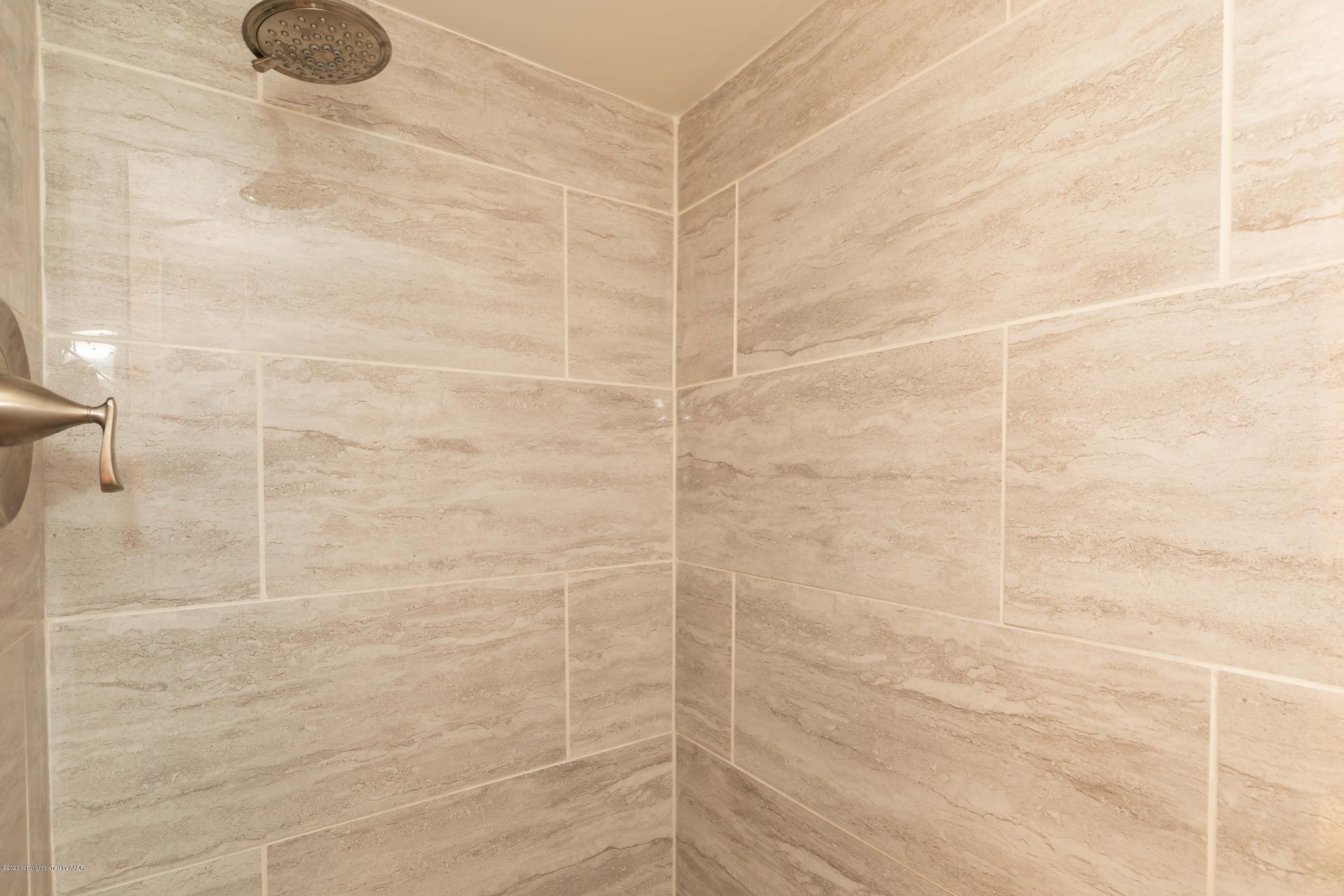 4712 South Bryan Street Amarillo, TX 79110 - Photo 22 of 36 a bathroom with a shower