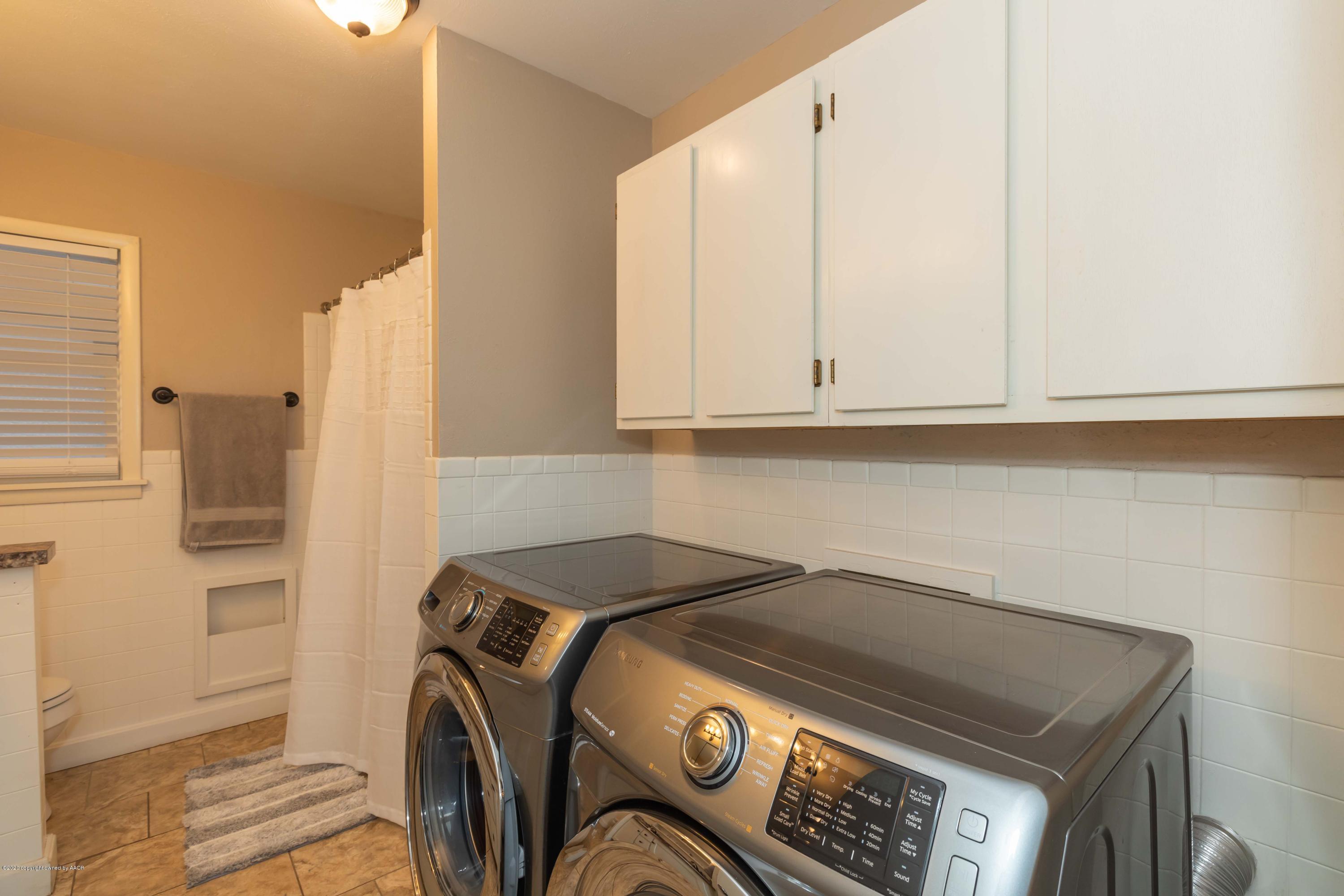 4712 South Bryan Street Amarillo, TX 79110 - Photo 32 of 36 a utility room with dryer and washer