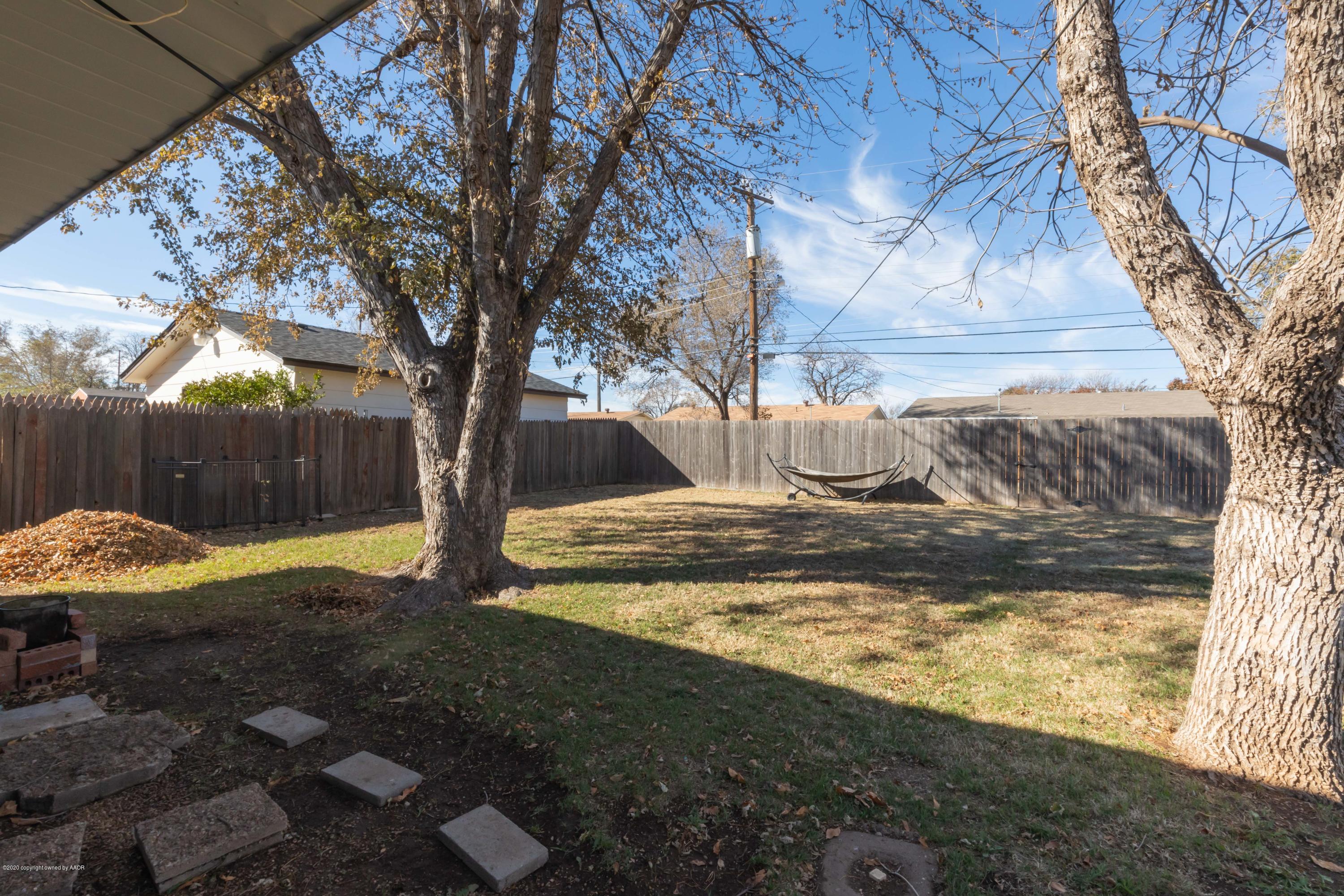 4712 South Bryan Street Amarillo, TX 79110 - Photo 34 of 36 a view of a yard with wooden fence
