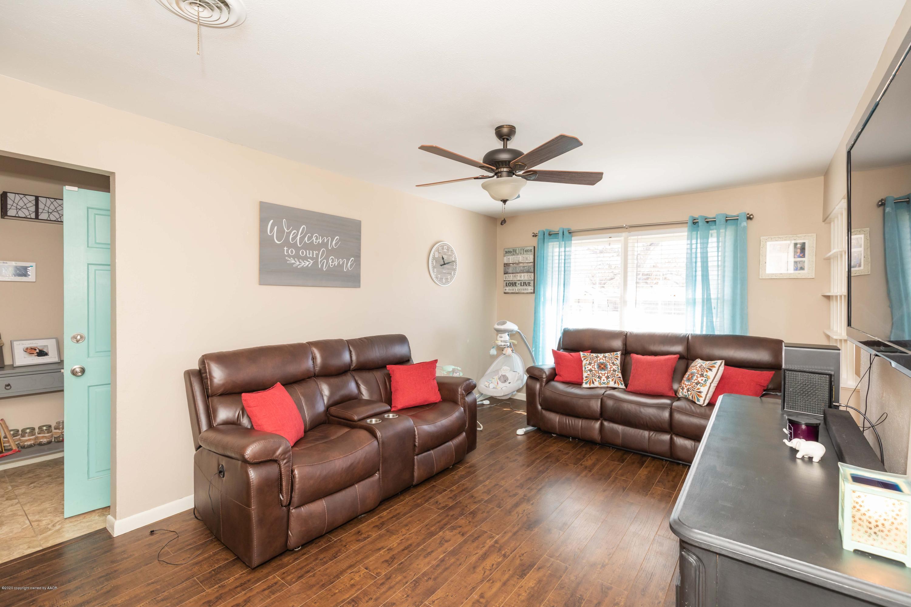 4712 South Bryan Street Amarillo, TX 79110 - Photo 8 of 36 a living room with furniture and a large window