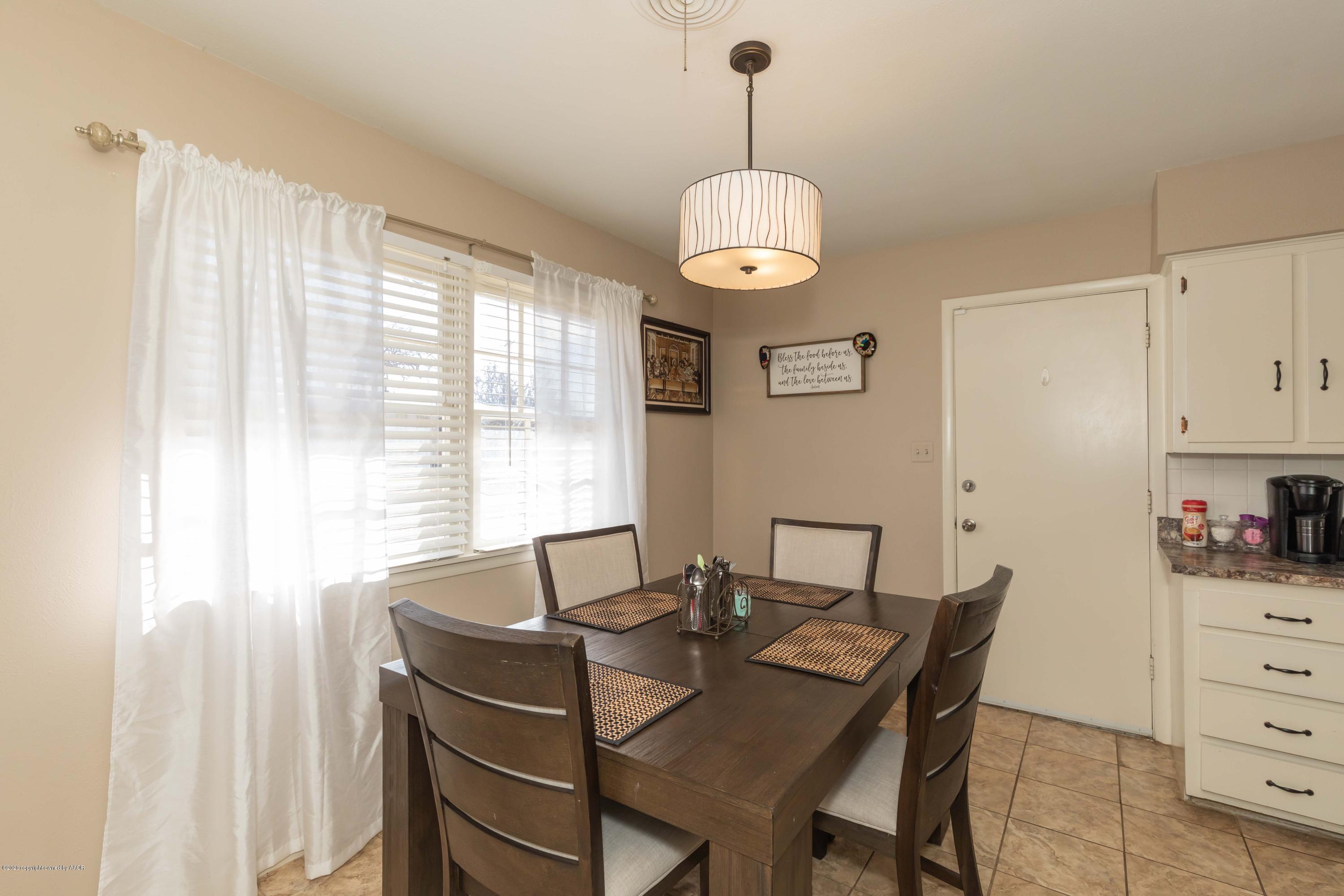 4712 South Bryan Street Amarillo, TX 79110 - Photo 10 of 36 a view of a dining room and a window