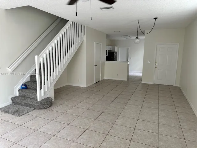a view of entryway and hall with a window