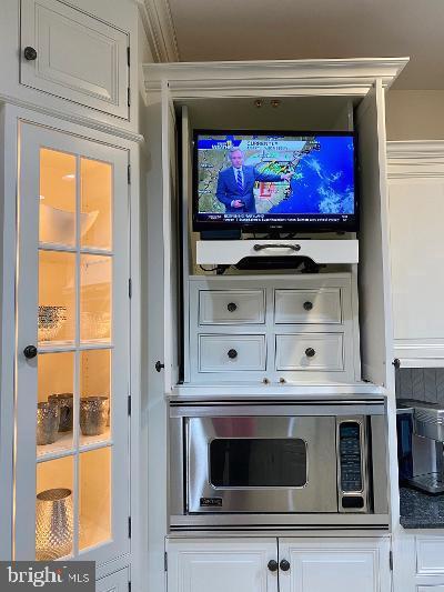 201 Morning Cloak Row Edgewater, MD 21037 - Photo 20 of 75 Doors open to TV cabinet (slides in and out)
