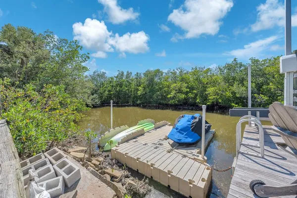 a view of a porch with wooden floor and windows