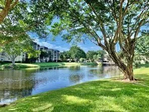 a view of a lake with a house in the background