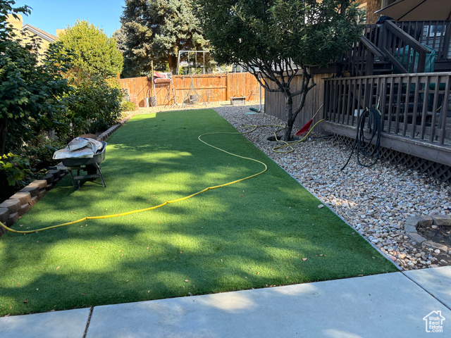 1874 South Main Street Orem, UT 84058 - Photo 13 of 15 Fenced backyard featuring a deck