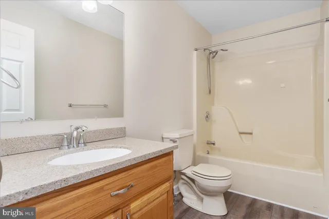 a view of a backyard with wooden fence