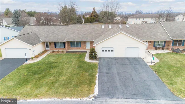 a aerial view of a house with a yard