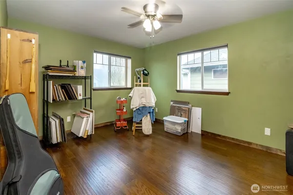a bedroom with furniture and a flat screen tv