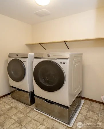 a bathroom with a sink double vanity and a mirror