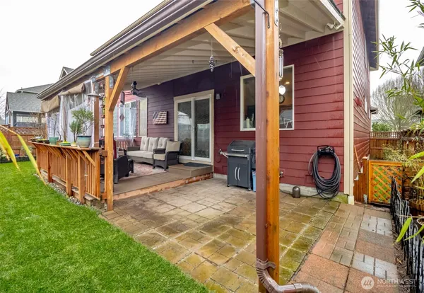 a view of a house with a yard and sitting area