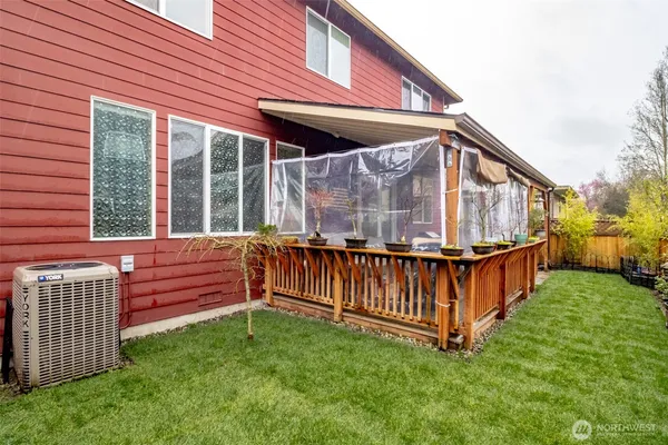 a view of a small yard with wooden fence