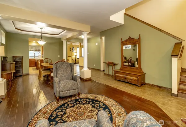 a view of a dining room with furniture and wooden floor