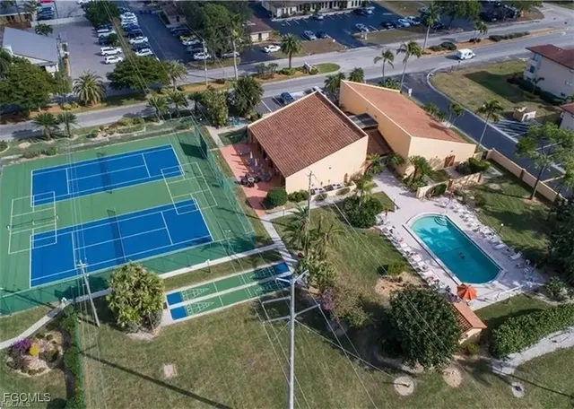 an aerial view of residential houses with outdoor space