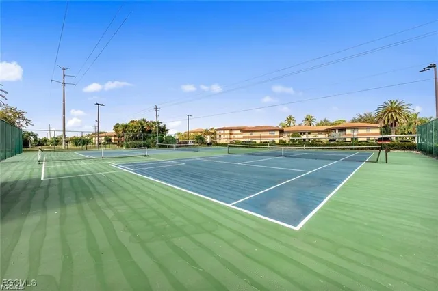 a view of an outdoor space and tennis court