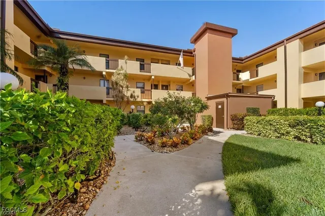 a front view of a building with garden