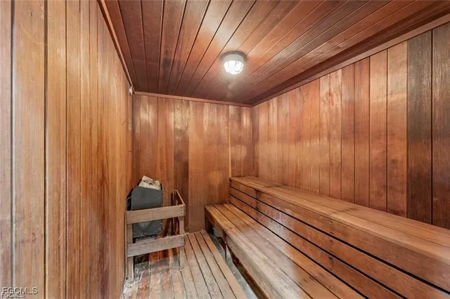 a view of room with stairs and wooden floor