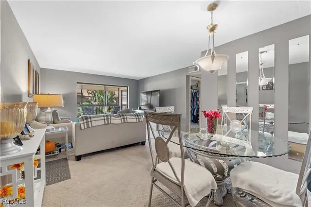 a very nice looking dining room with a table and chairs