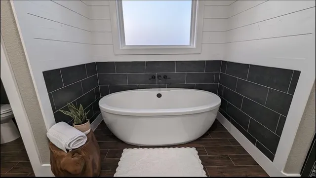 a bed room with two beds and a chair