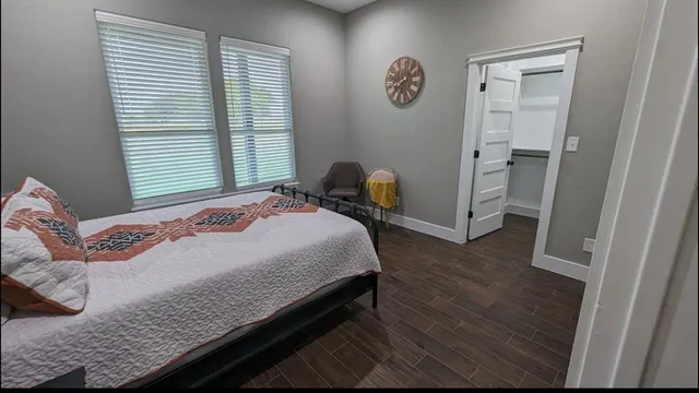 a bathroom with a toilet a sink and a mirror