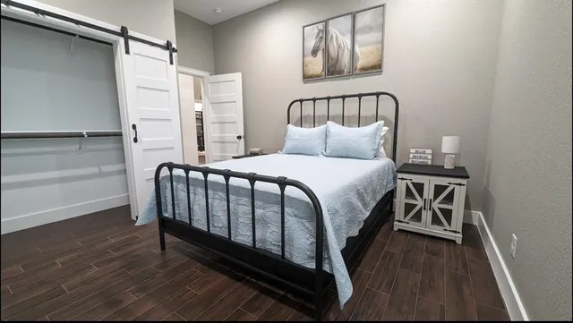 a view of a workspace with furniture and wooden floor