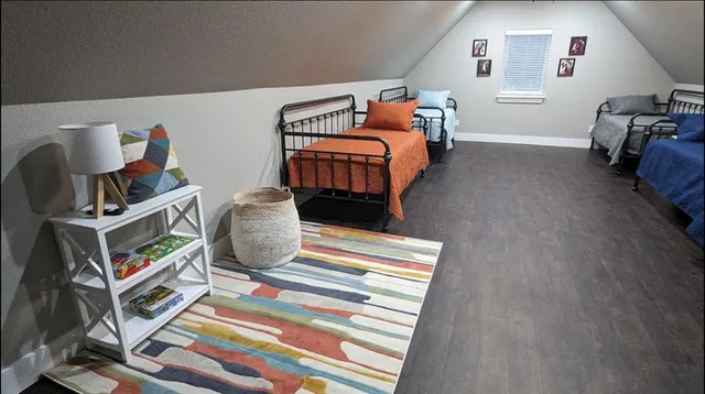a kitchen with a refrigerator and a stove top oven