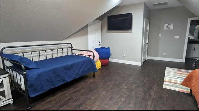 a kitchen with a stove and a refrigerator