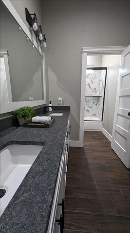 a front view of a house with a garden and plants