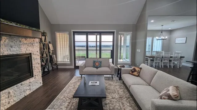 a living room with furniture and a fireplace
