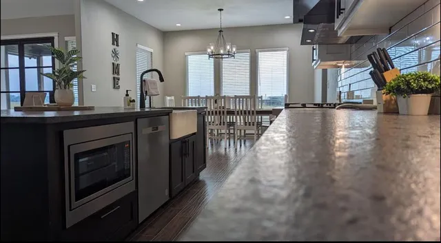 a house that has a big yard plants and large trees