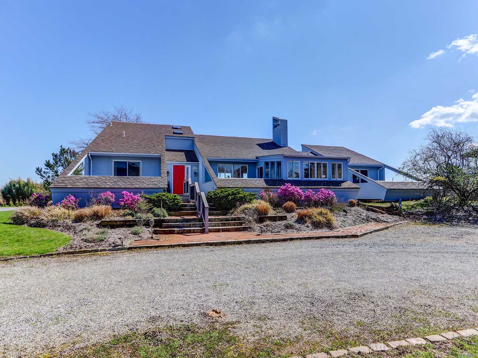 3 Duck Point Road Remsenburg, NY 11960 - Photo 1 of 1 front view of house with a street view