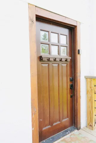 a view of a room that has a bed in it