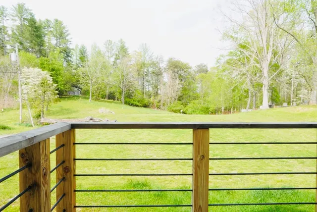 a view of a yard with an outdoor seating