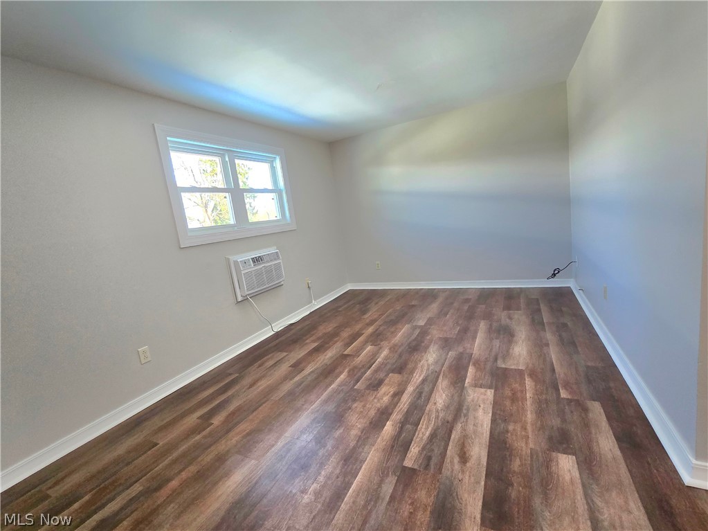 909 Garden Road Zanesville, OH 43701 - Photo 8 of 8 Spare room featuring dark wood finished floors and baseboards
