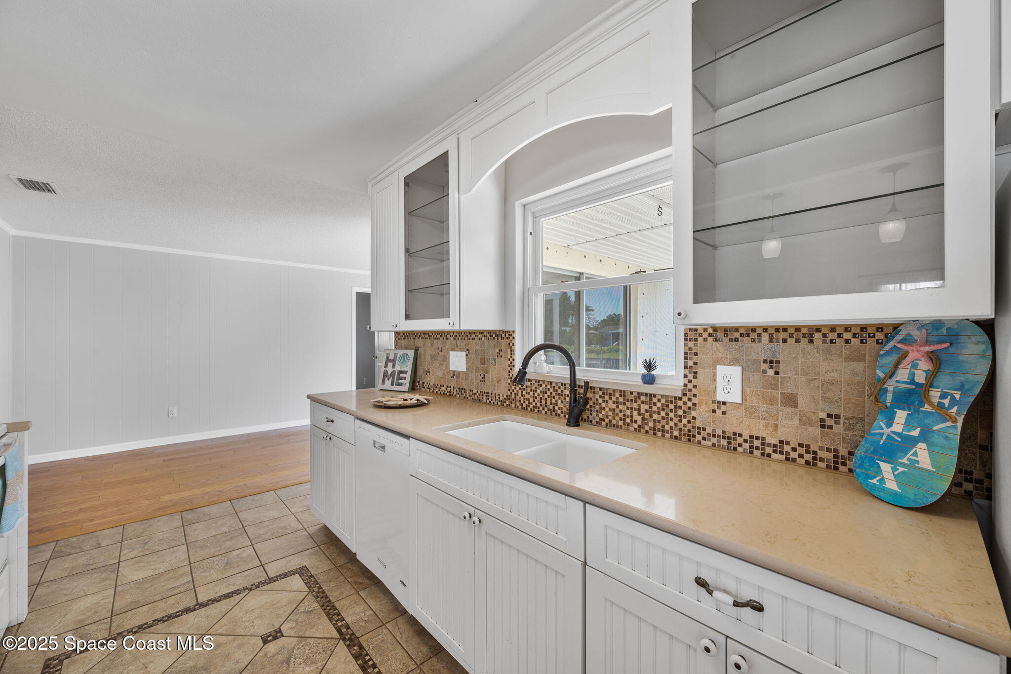 437 Eagle Drive Satellite Beach, FL 32937 - Photo 12 of 30 a spacious bathroom with a granite countertop sink and a mirror