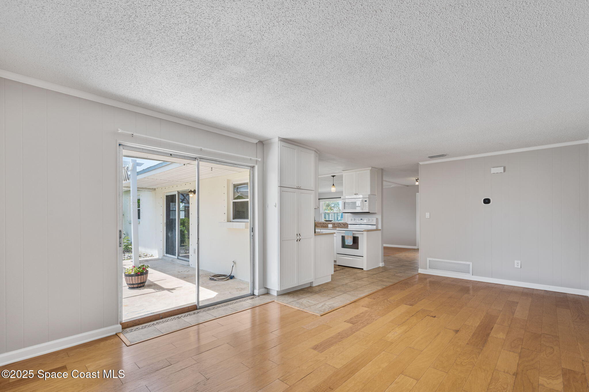 437 Eagle Drive Satellite Beach, FL 32937 - Photo 15 of 30 a view of a kitchen with a sink and a refrigerator